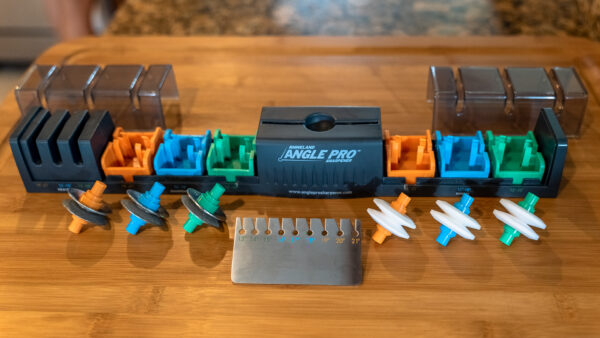 Angle Pro Sharpener disassembled on a wood cutting board; Promo Shot