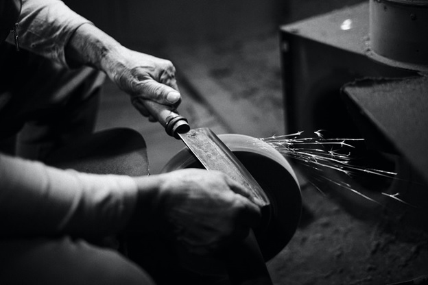 A man sharpening a knife